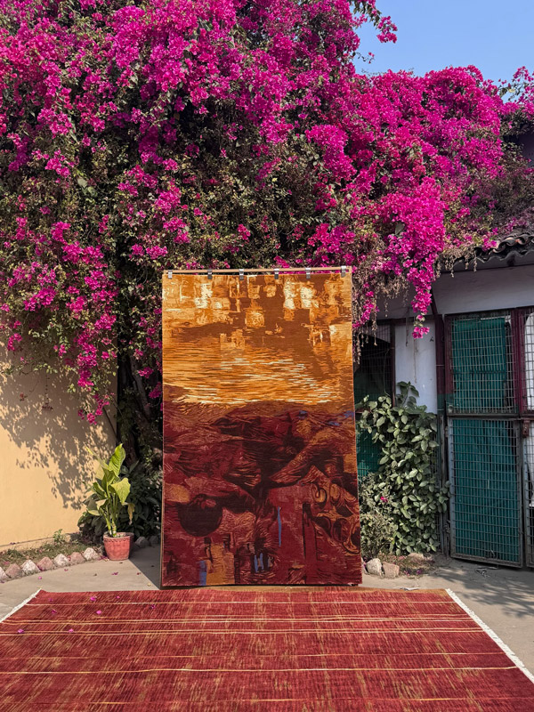 Angeli carpet and painting outside in India