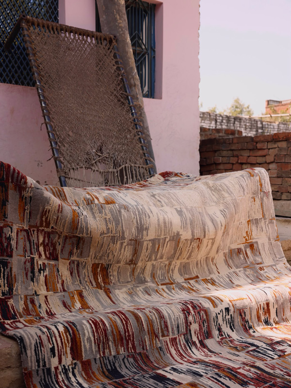 Angeli rug outside building